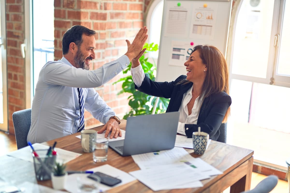 A Middleman client and their placed hire celebrating a win